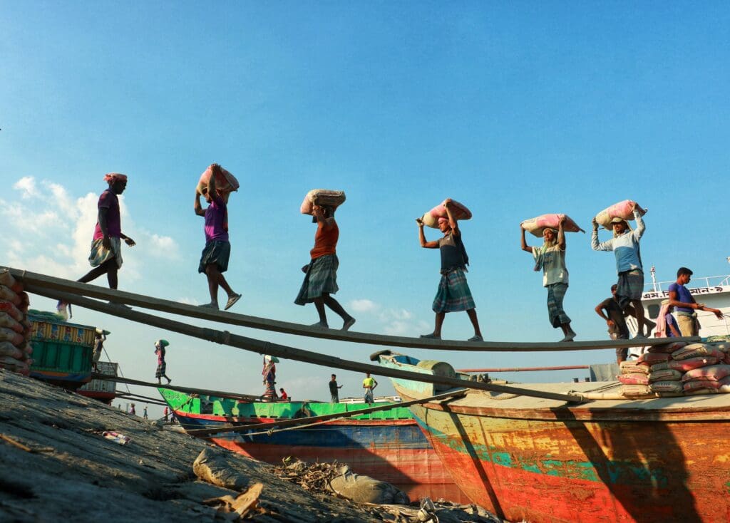 Workers carry bags from boat to boat to make a living just like the day-to-day life around the world. Culture-focused travel builds a sense of collectivism and empathy. Very Valuable life skills